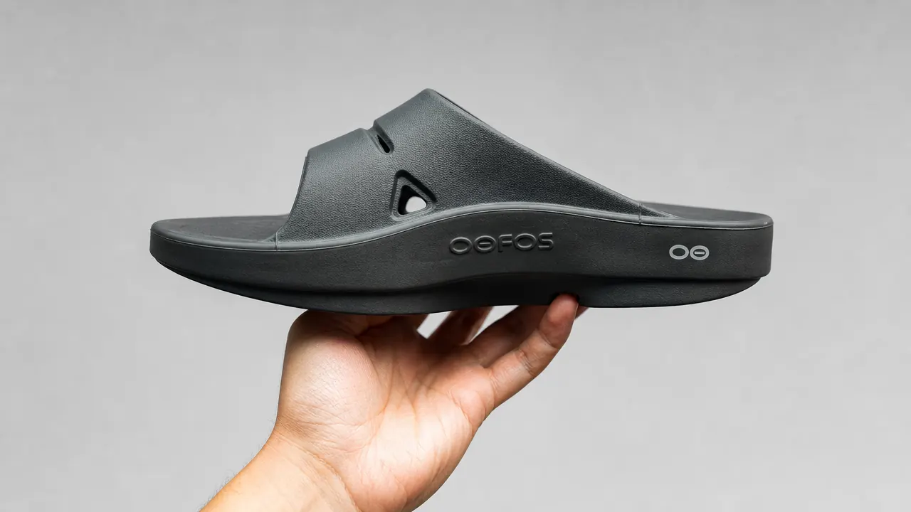 Close-up of the OOFOS OOriginal sandal footbed showing the deep arch cradle and thick OOfoam midsole from a side angle