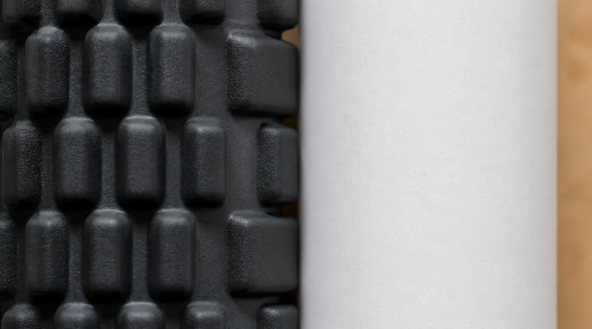 Close-up of the TriggerPoint GRID surface showing multi-density grid pattern next to smooth plain foam